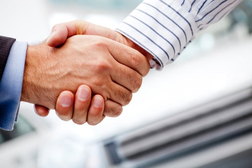Business handshake after buying